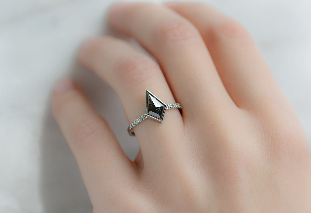 The Willow Ring with a Kite Shaped Black Diamond on Model
