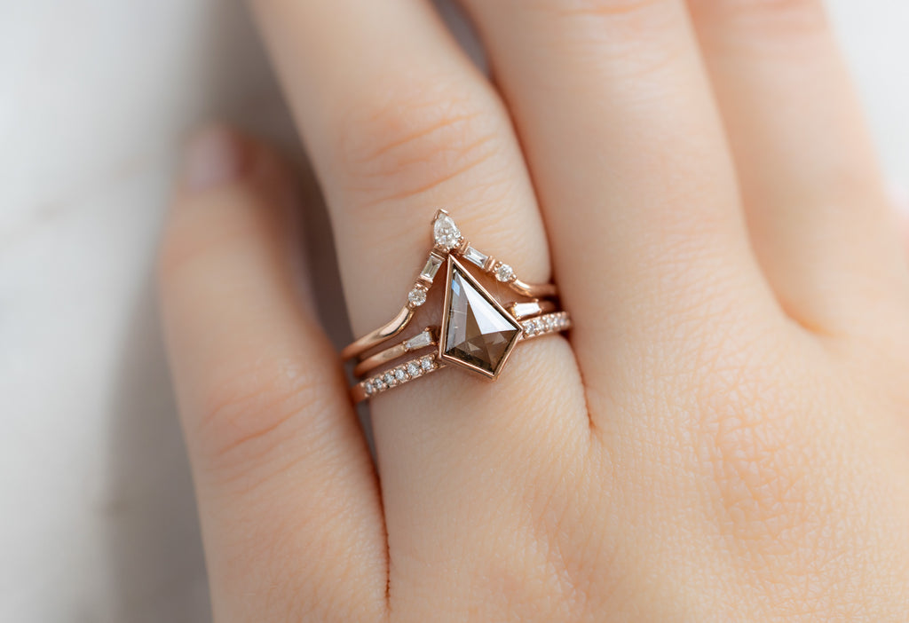 The Willow Ring with a Kite-Shaped Pink Diamond with White Diamond Stacking Bands on Model