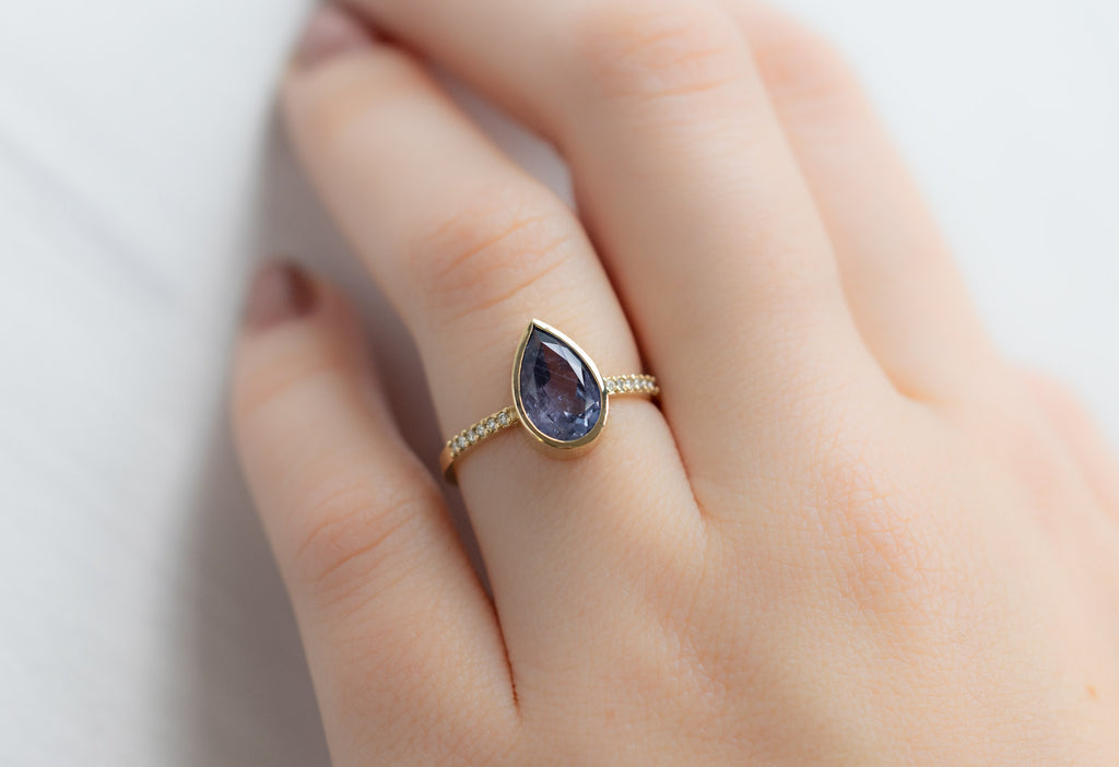 The Willow Ring with a Pear-Cut Blue Violet Sapphire on Model