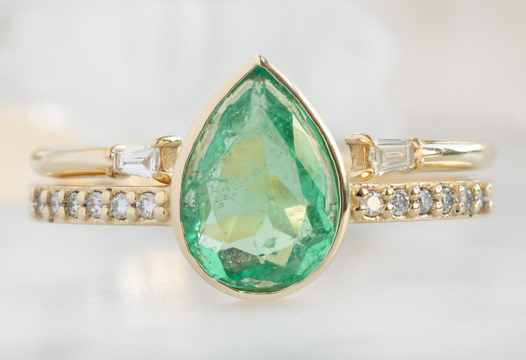 The Willow Ring with a Pear-Cut Emerald with Open Cuff Baguette Stacking Band