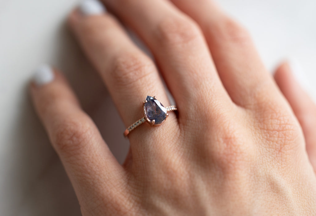 The Willow Ring with a Pear-Cut Grey-Violet Sapphire on Model