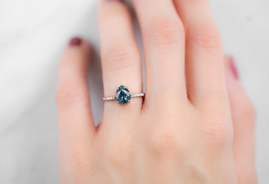 The Willow Ring with a Pear-Cut Montana Sapphire on Model