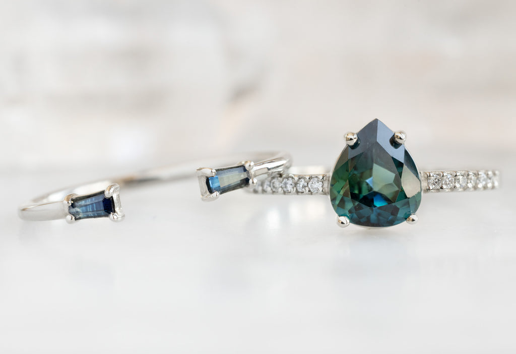 The Willow Ring with a Pear-Cut Sapphire with Montana Sapphire Baguette Stacking Band