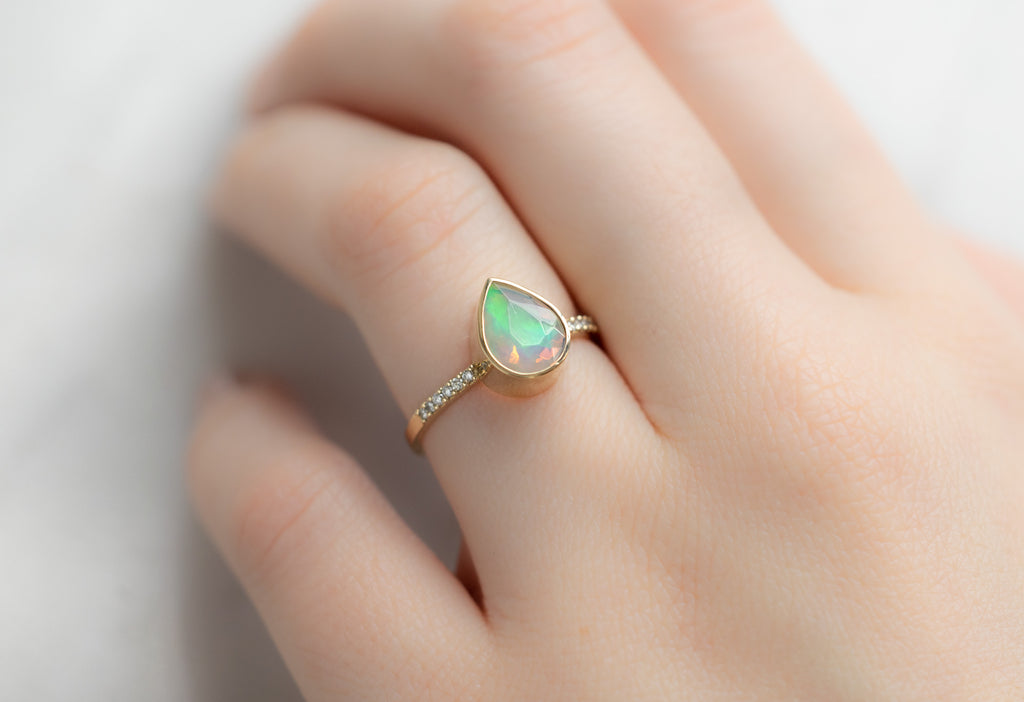 The Willow Ring with a Pear-Cut Opal on Model