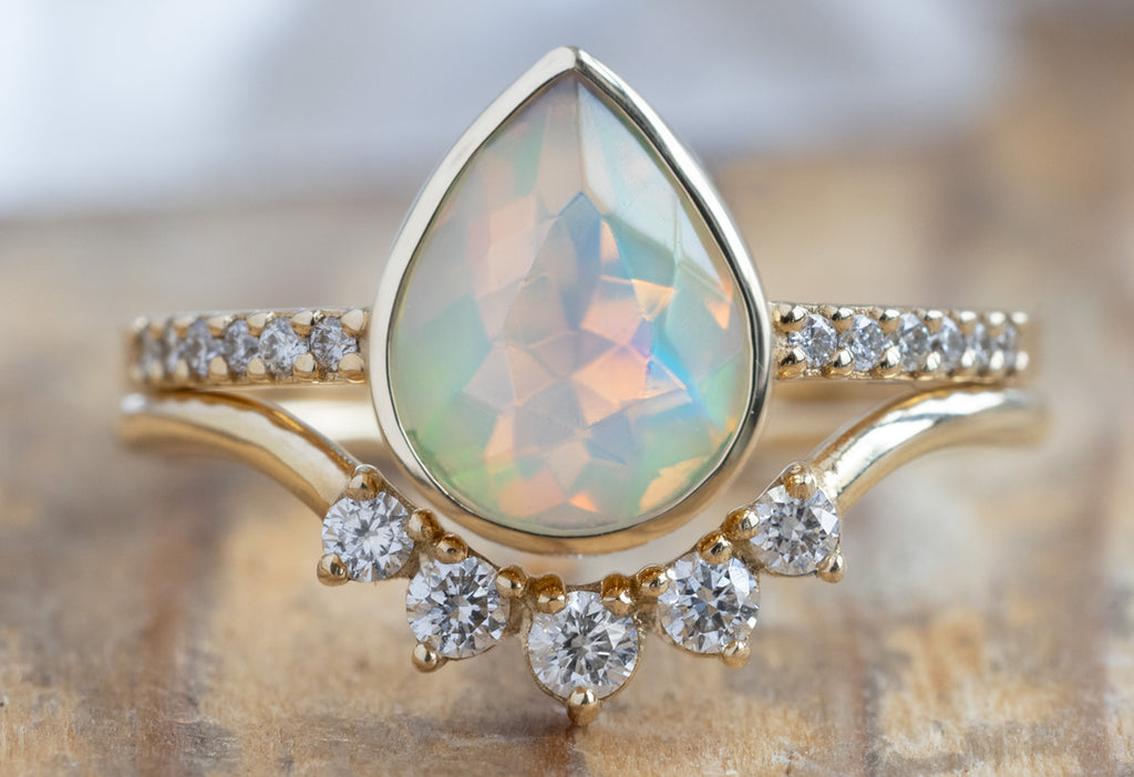 The Willow Ring with a Pear-Cut Opal with Round Diamond Sunburst Stacking Band