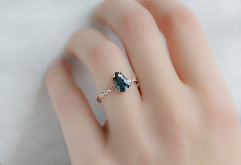 The Willow Ring with a Pear-Cut Sapphire on Model