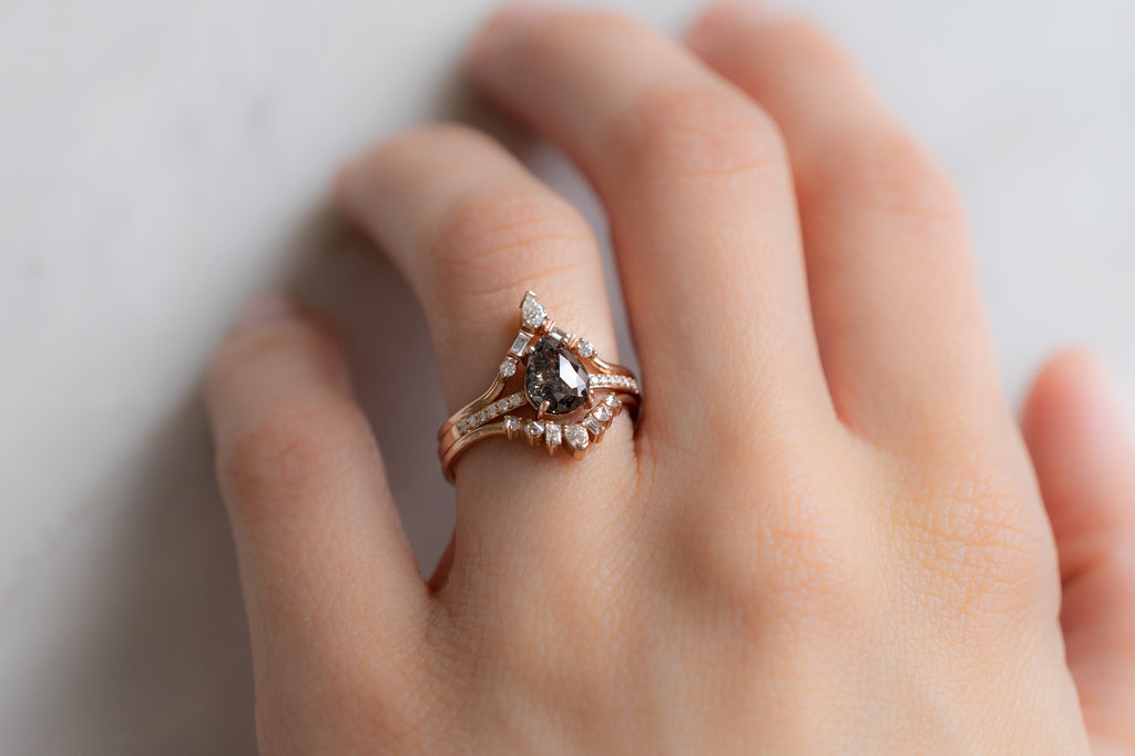 The Willow Ring with a Rose-Cut Black Diamond with Stacking Bands on Model
