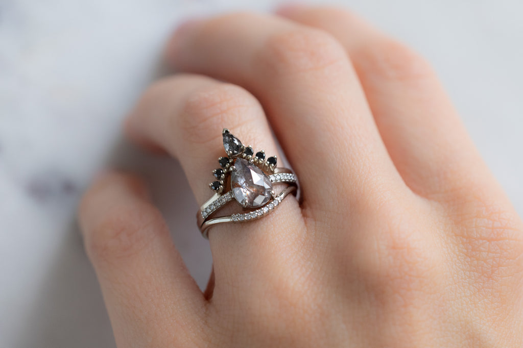 The Willow Ring with a Rose-Cut Red Diamond with Stacking Bands on Model
