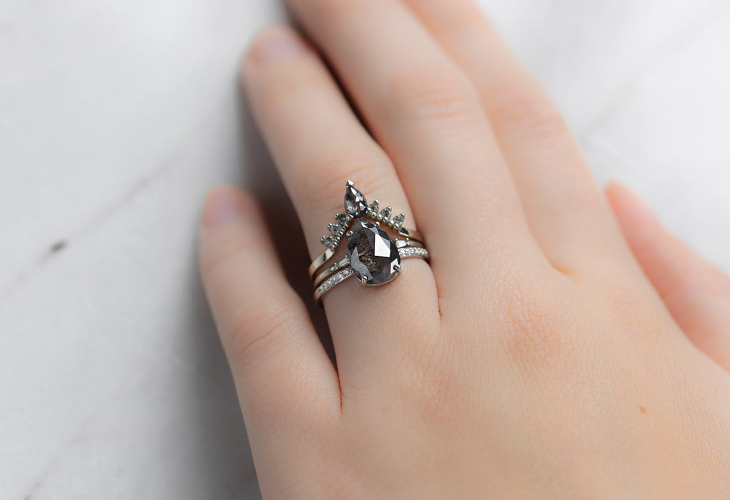 The Willow Ring with a Rose-Cut Salt and Pepper Diamond with Stacking Bands on Model
