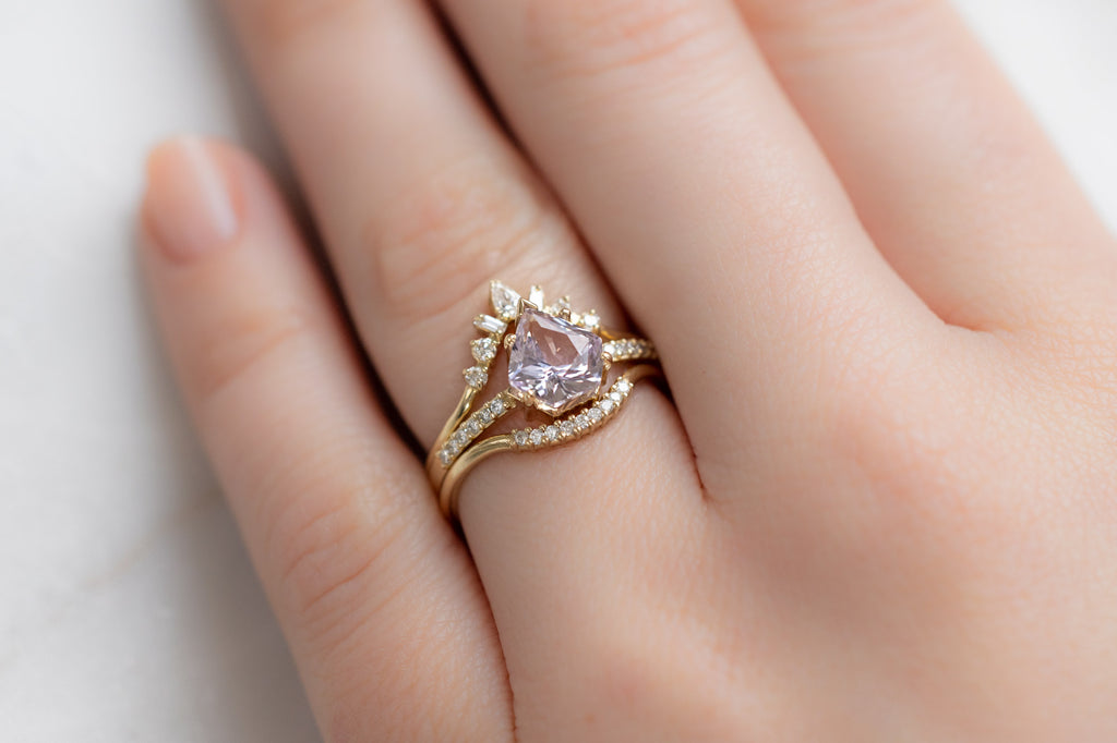 The Willow Ring with a Shield-Cut Lilac Sapphire with White Diamond Stacking Bands on Model