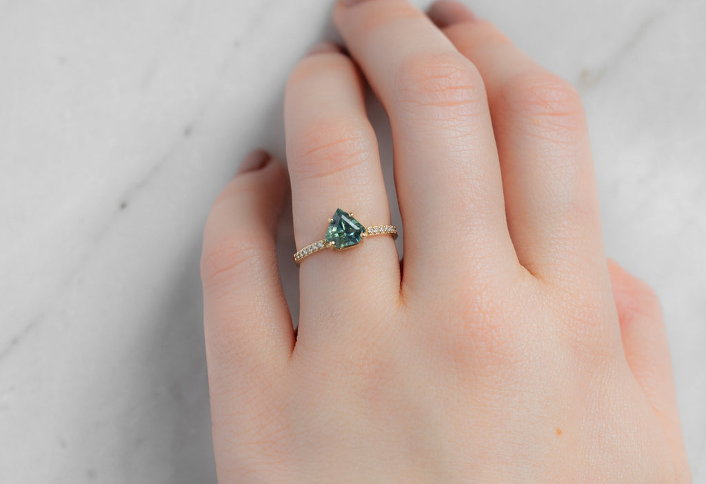 The Willow Ring with a Shield-Cut Montana Sapphire on Model