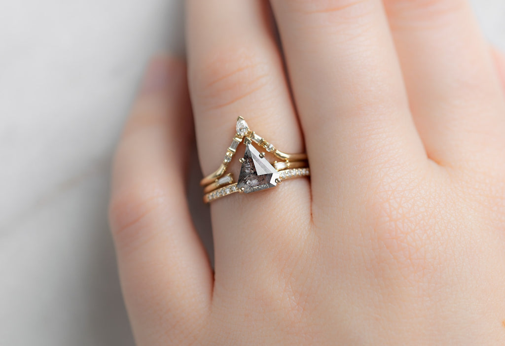 The Willow Ring with a Shield-Cut Salt and Pepper Diamond with Stacking Bands on Model