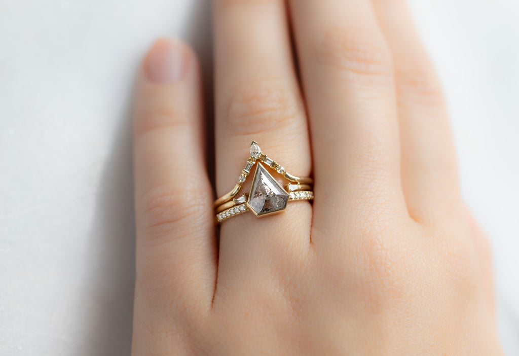 The Willow Ring with a Shield-Cut Salt and Pepper Diamond with White Diamond Stacking Bands on Model