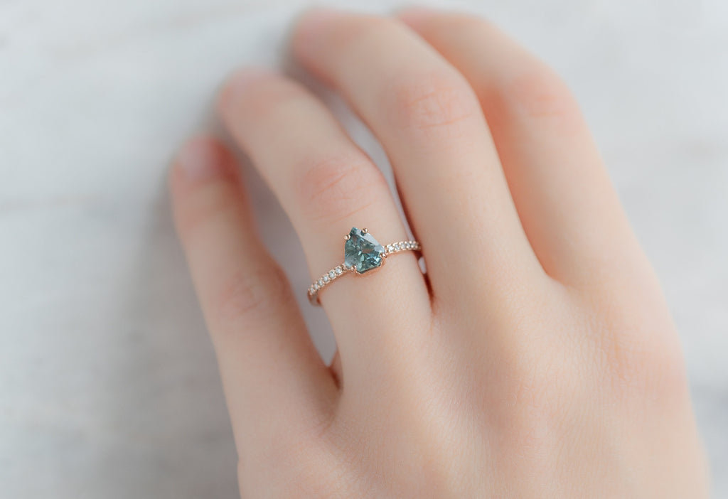 The Willow Ring with a Shield-Cut Sapphire on Model