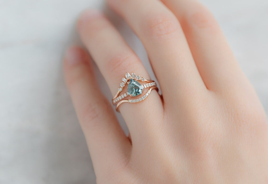The Willow Ring with a Shield-Cut Sapphire with White Diamond Stacking Bands on Model