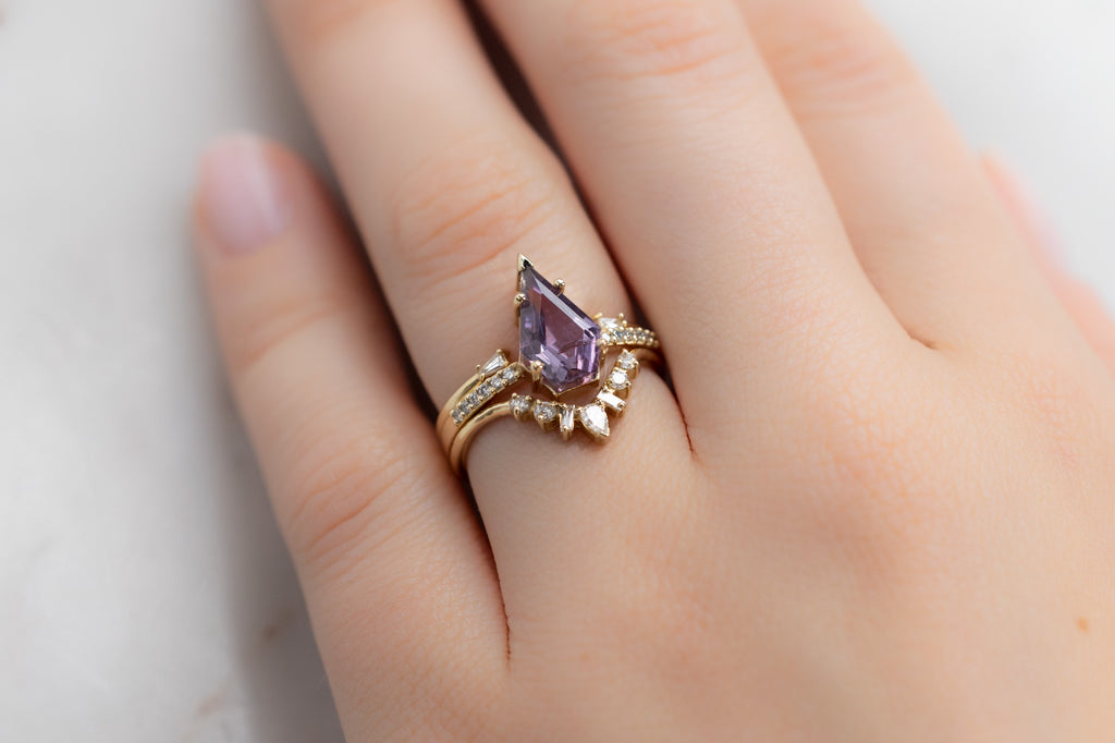 The Willow Ring with a Shield-Cut Violet Sapphire with White Diamond Stacking Bands on Model