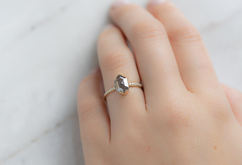 The Willow Ring with a Silvery Grey Hexagon Diamond on Model