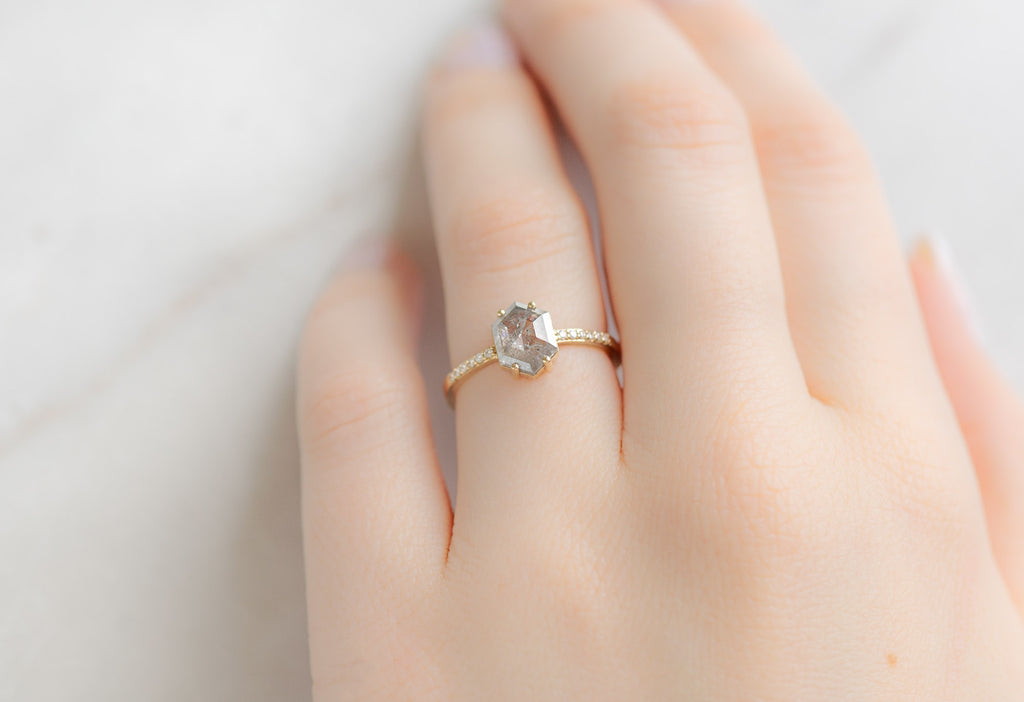 The Willow Ring with a Silvery Grey Hexagon Diamond on Model