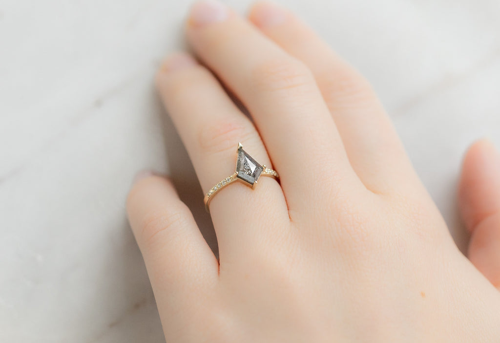 The Willow Ring with a Silvery-Grey Kite Diamond on Model