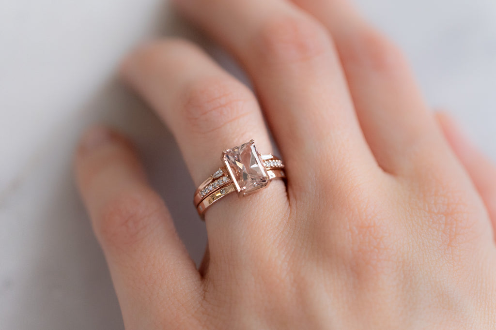 The Willow Ring with an Emerald-Cut Morganite with Stacking Bands on Model
