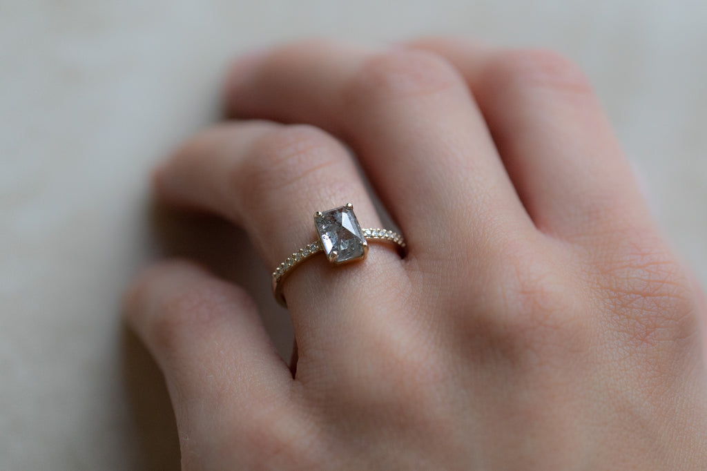 The Willow Ring with an Emerald Cut Salt and Pepper Diamond on model