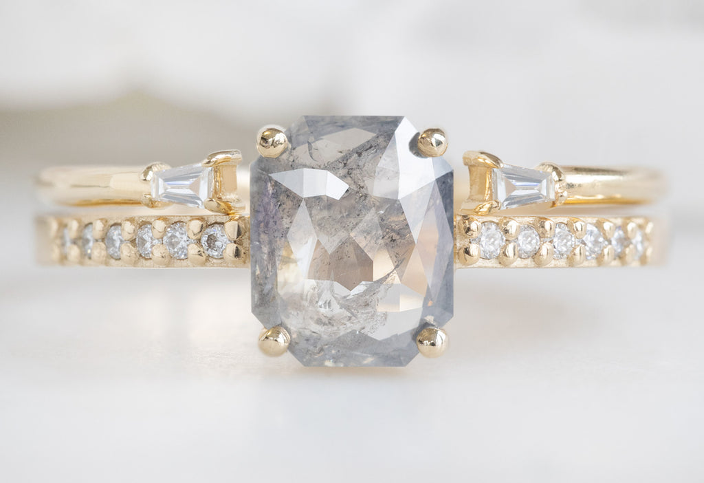 The Willow Ring with an Emerald-Cut Silvery Grey Diamond with Open Cuff Baguette Stacking Band