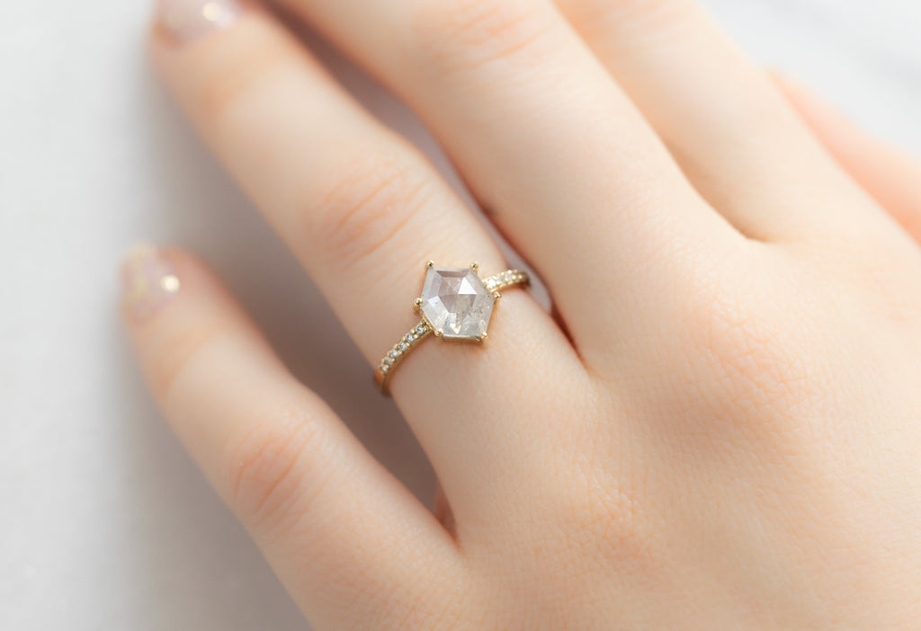 The Willow Ring with an Icy-White Hexagon Diamond on Model