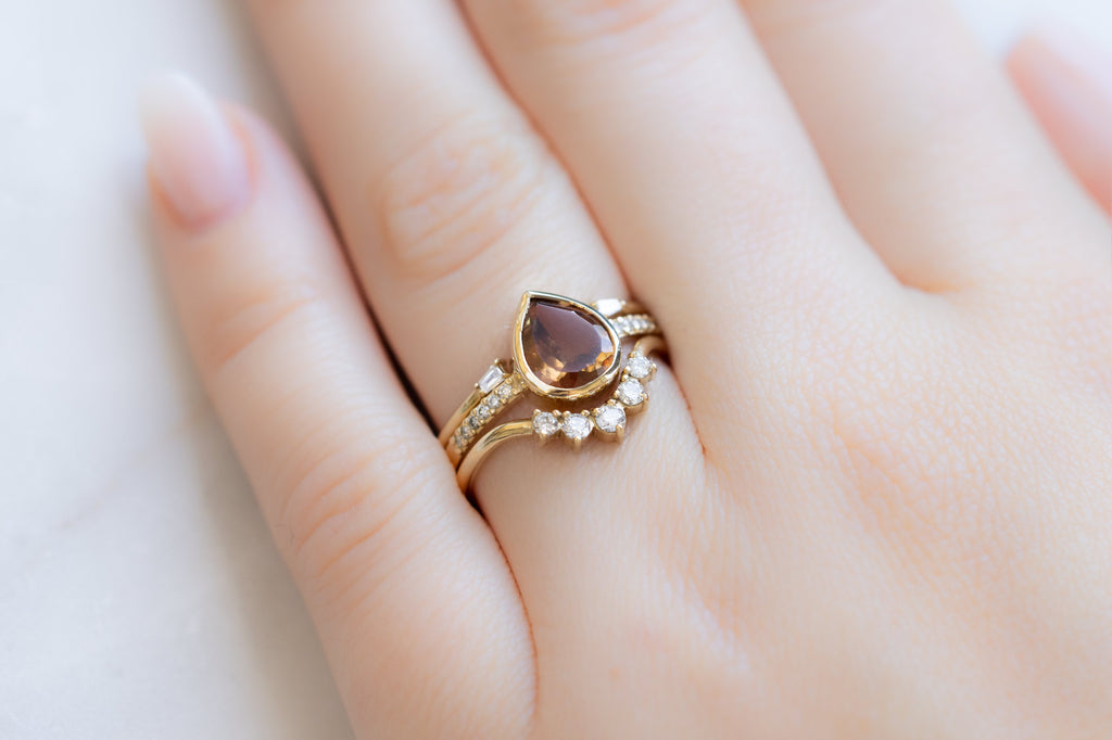 The Willow Ring with an Ochre Sapphire with White Diamond Stacking Bands on Model