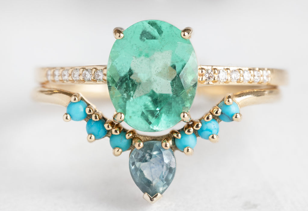 The Willow Ring with an Oval-Cut Emerald with Turquoise Wedding Band