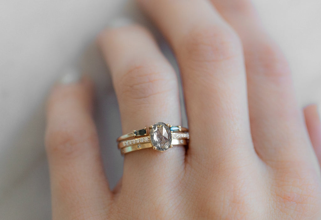 The Willow Ring with an Oval-Cut Salt and Pepper Diamond with Stacking Bands on Model