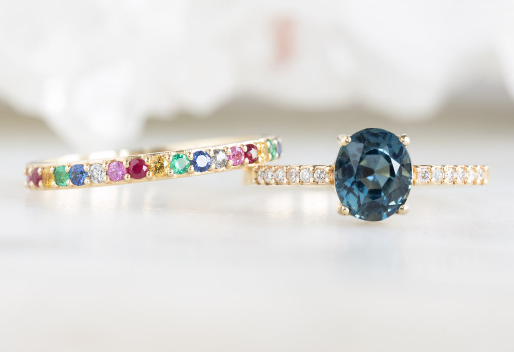 The Willow Ring with an Oval-Cut Sapphire with Pavé Rainbow Sapphire Eternity Band