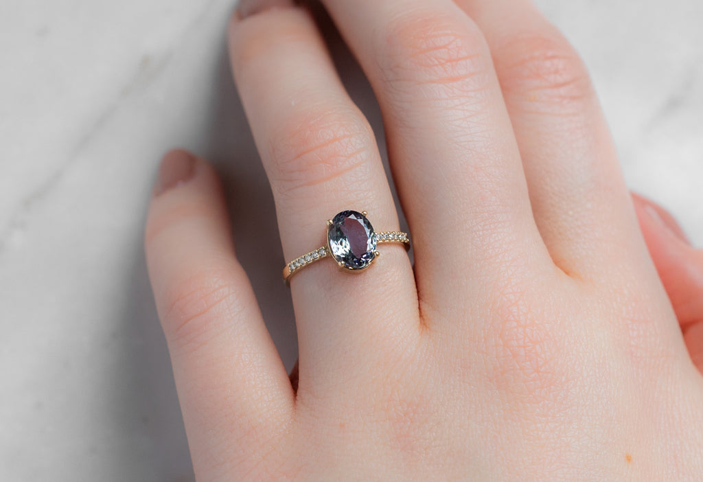 The Willow Ring with an Oval-Cut Tanzanite on Model