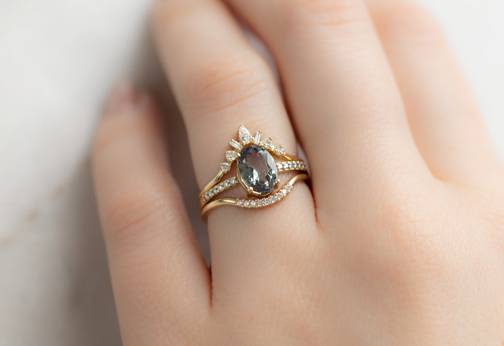 The Willow Ring with an Oval-Cut Tanzanite with White Diamond Stacking Bands on Model