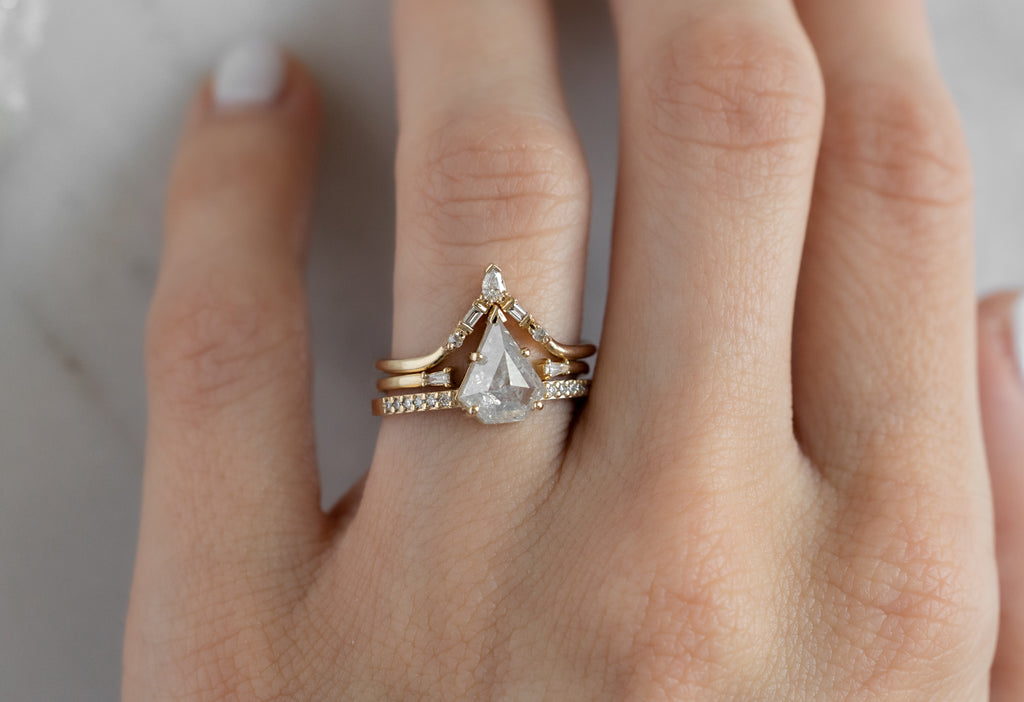 The Willow Ring with an Shield-Cut Icy-White Diamond with Stacking Bands on Model