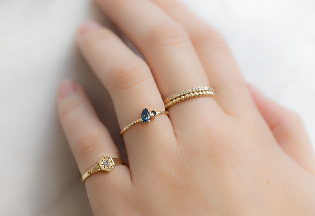 The You & Me Ring with a Montana Sapphire + Salt and Pepper Diamond Stacked on Model