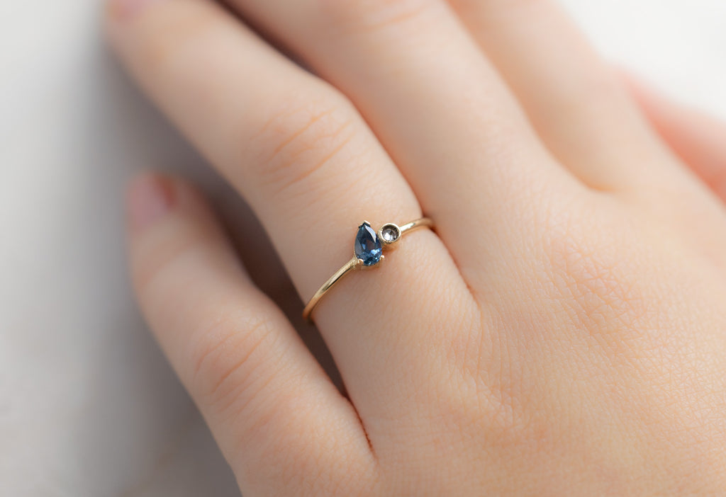 The You & Me Ring with a Montana Sapphire + Salt and Pepper Diamond on Model