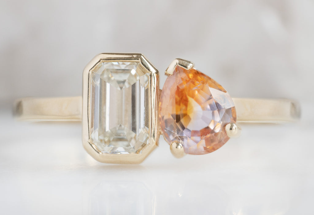 The You & Me Ring with an Emerald-Cut White Diamond + Bicolor Sapphire