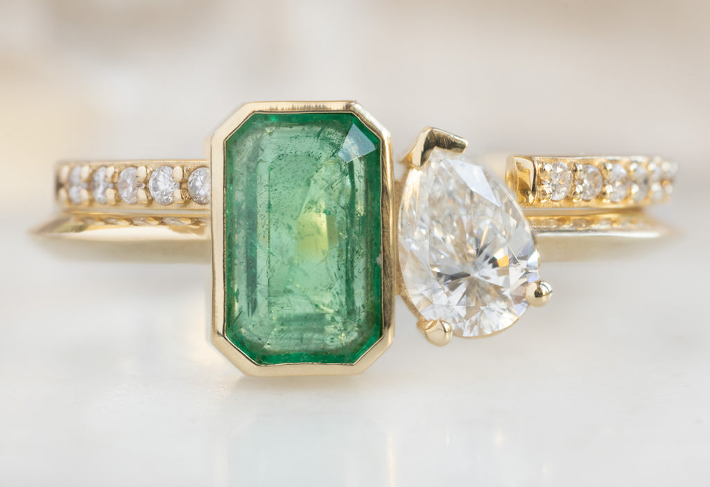 The You & Me Ring with an Emerald + White Diamond with open Cuff Pave Diamond Stacking Band
