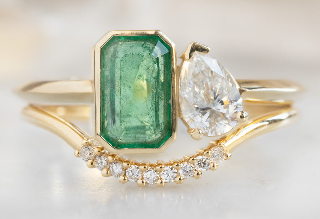 The You & Me Ring with an Emerald + White Diamond with Pave Arc Stacking Band
