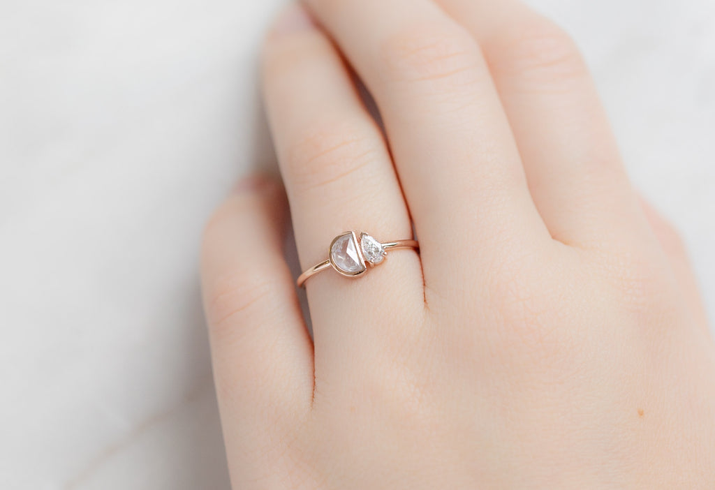 The You & Me Ring with an Opalescent Half-Moon + White Diamond on Model