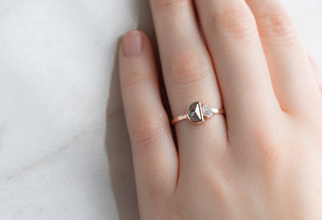 The You & Me Ring with a Black Half-Moon + Pear-Cut White Diamond on Model