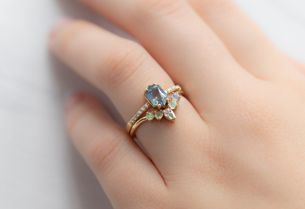 Opal and Diamond Sunburst Stacking Band Stacked on Model with Sapphire Gemstone Engagement Ring