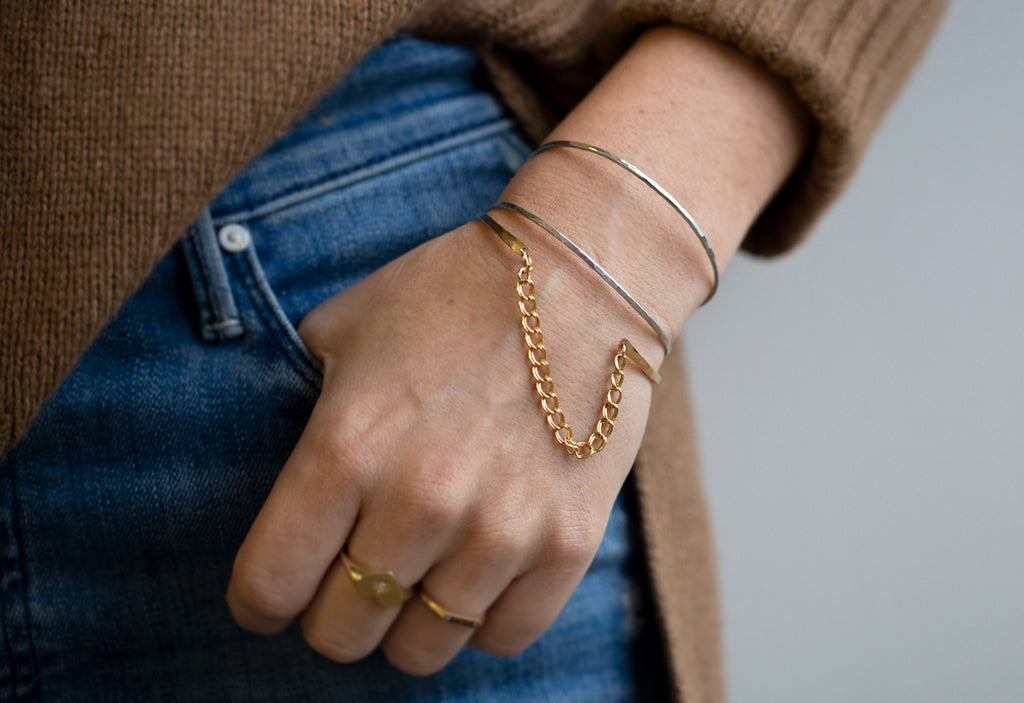 Sterling Silver Arrow Cuff Bracelet Stacked with Muse Bracelet on Model