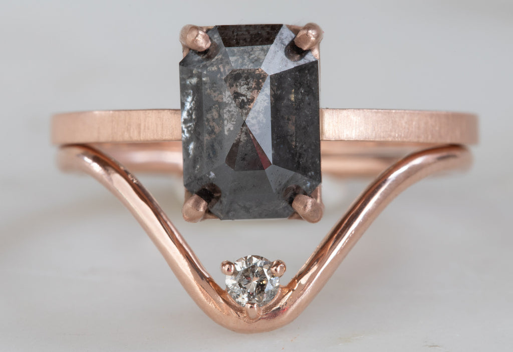 Rose Gold Peak Diamond Stacking Ring on bottom of black diamond engagement ring