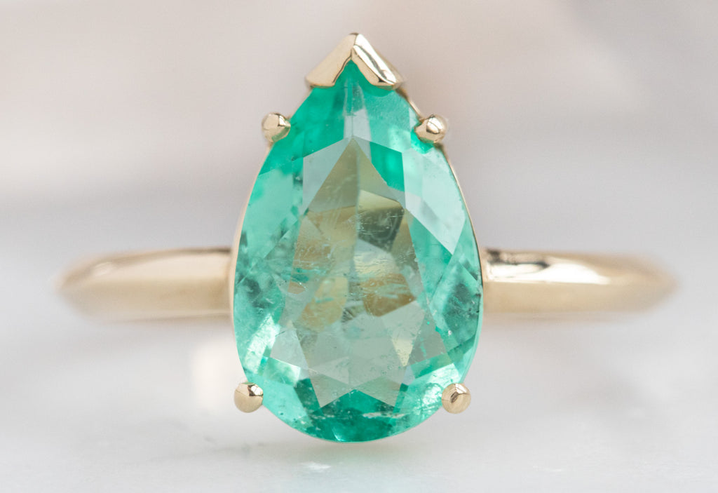 The Sage Ring with a Pear Cut Emerald