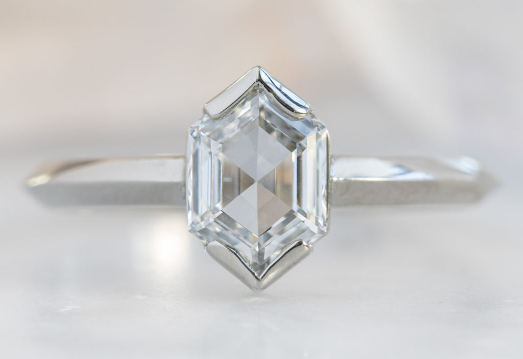 The Sage Ring with a Hexagon-Cut White Diamond