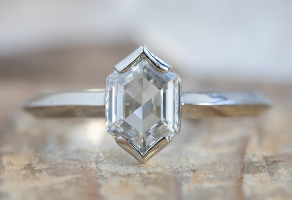 The Sage Ring with a Hexagon-Cut White Diamond