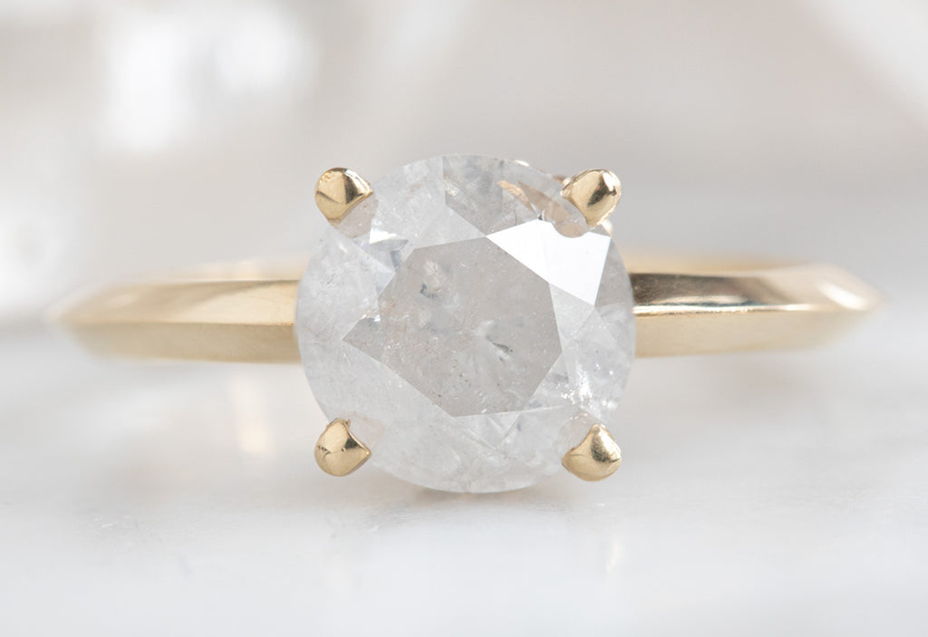 The Iris Ring with an Opalescent Round Diamond