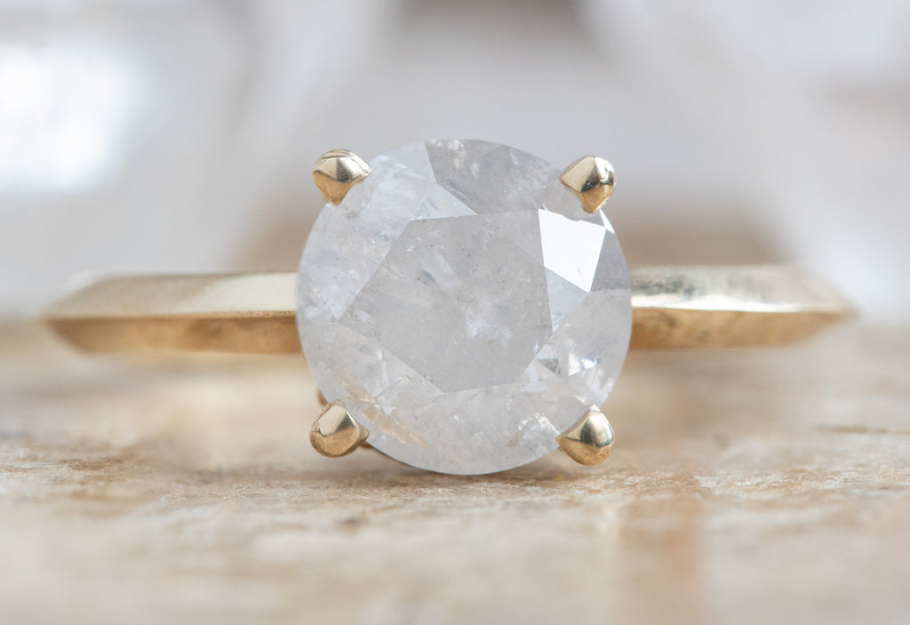 The Iris Ring with an Opalescent Round Diamond