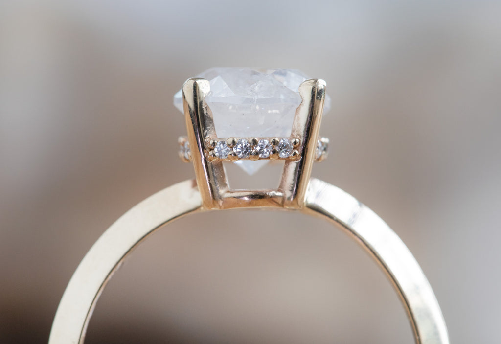 The Iris Ring with an Opalescent Round Diamond